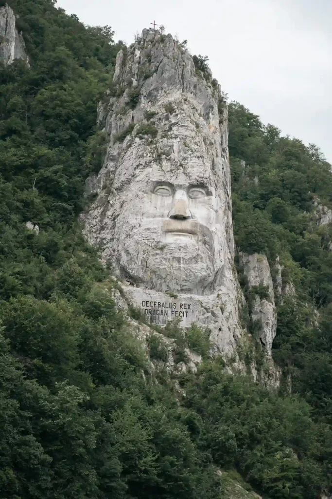 A photo of a rock sculpture of Decebalus in Romania Top 10 Fairytale Places