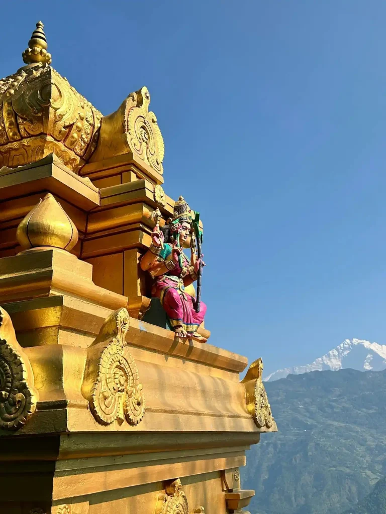 Golden temple ornament with mountain backdrop in Nepal Top 10 Fairytale Places